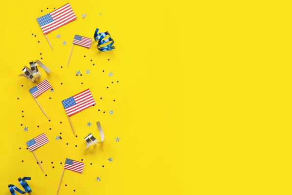 stock image USA flags with serpentine and stars on yellow background. Independence Day celebration