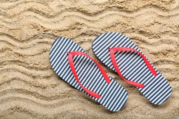 Striped Flip Flops Sand Top View Stock Photo