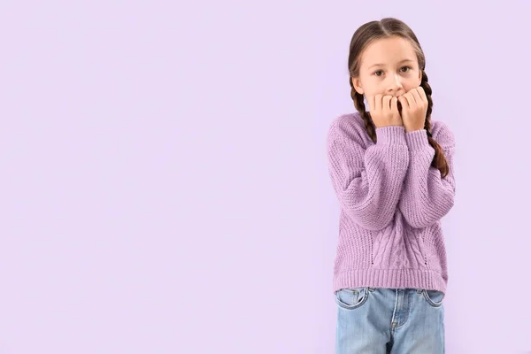 Little Girl Biting Nails Lilac Background — Stockfoto