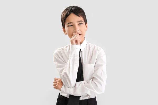 Little Schoolboy Biting Nails Grey Background — Stock Photo, Image