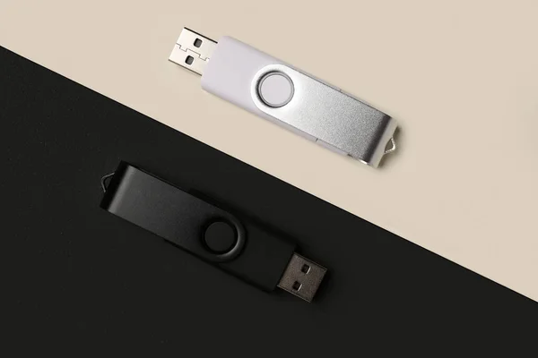 USB flash drives on black and white background