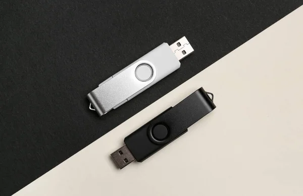 USB flash drives on black and white background