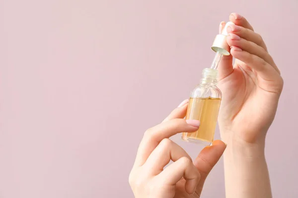 Female Hands Bottle Cuticle Oil Color Background Closeup — Stock Photo, Image