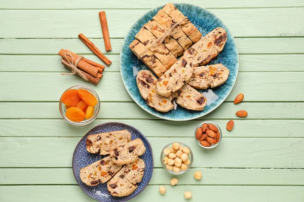 Composition Tasty Biscotti Cookies Nuts Cinnamon Dried Apricots Color Wooden — Stock Photo, Image