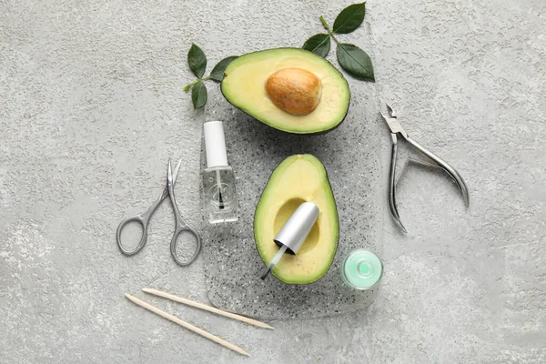 Composition Bottles Cuticle Oil Manicure Instruments Avocado Grunge Background — Stock Photo, Image