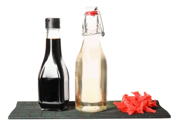 Bottles Rice Vinegar Soy Sauce Ginger Bamboo Mat White Background — Stock Photo, Image
