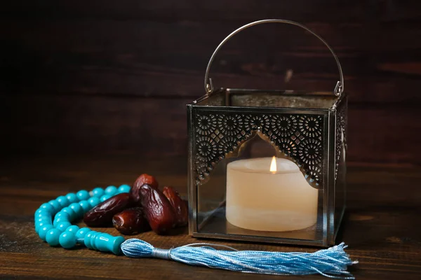 Muslim Lamp Burning Candle Dates Prayer Beads Dark Wooden Background — Stock Photo, Image