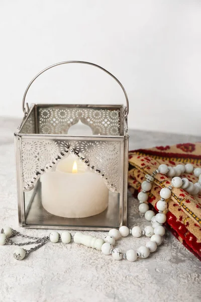 Muslim Lamp Burning Candle Prayer Beads Mat Table White Wall — Stock Photo, Image