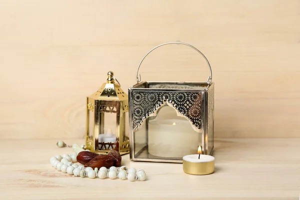 Muslim Lamps Burning Candles Dates Prayer Beads Light Wooden Background — Stock Photo, Image