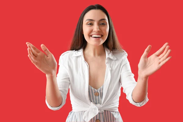 Young Woman Opening Arms Hug Red Background — Stock Photo, Image