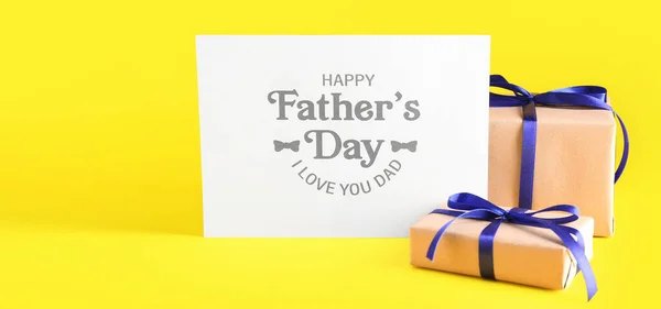 Greeting card for Father\'s Day and gifts on yellow background