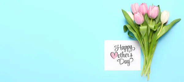 stock image Card with text HAPPY MOTHER'S DAY and tulips on light blue background with space for text
