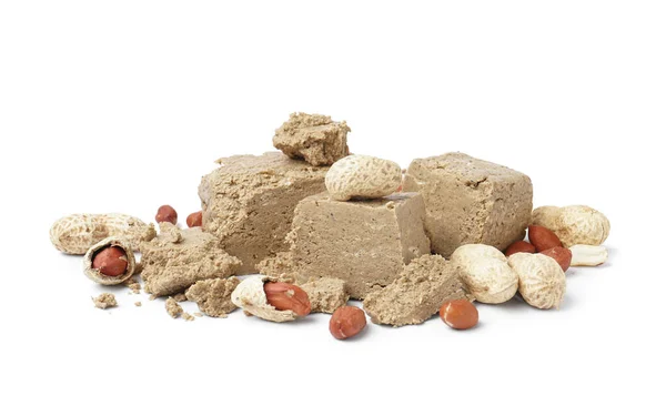 stock image Pieces of sweet halva with peanuts on white background