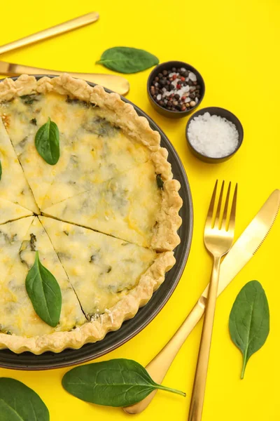 stock image Plate with pieces of delicious quiche, feta cheese and spices on yellow background