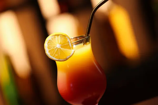 Glass Tasty Tequila Sunrise Lemon Slice Blurred Background Closeup — Stock Photo, Image