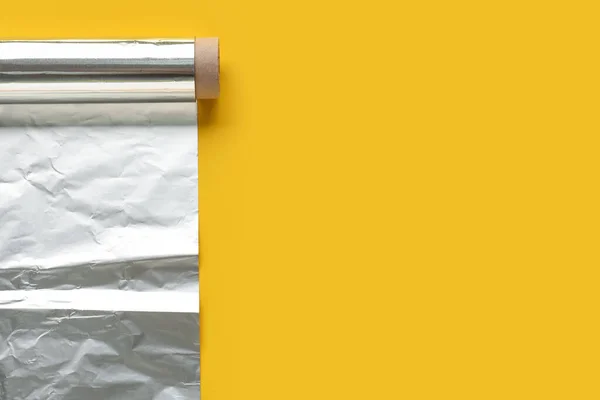 Roll Aluminium Foil Yellow Background — Foto de Stock