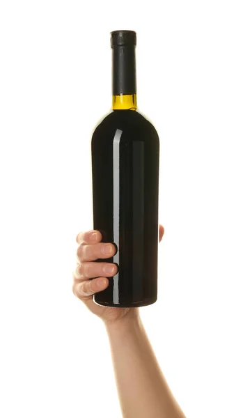 stock image Female hand holding bottle of red wine isolated on white background