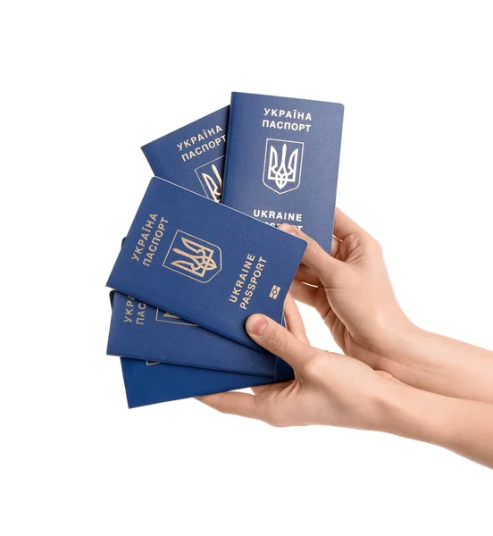 持乌克兰白色背景护照的妇女 — 图库照片