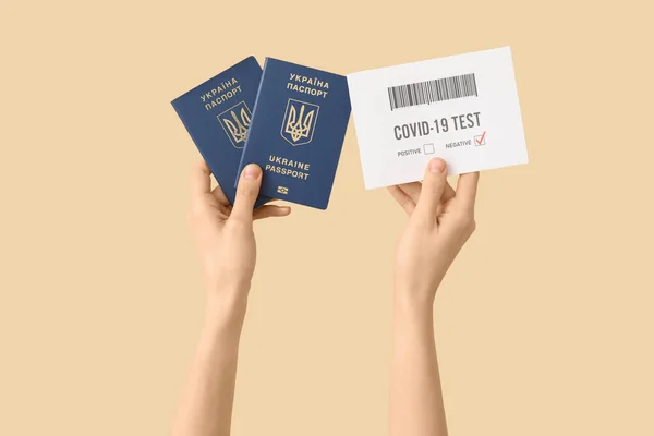 Woman Ukrainian Passports Negative Covid Test Result Beige Background — Stock Photo, Image
