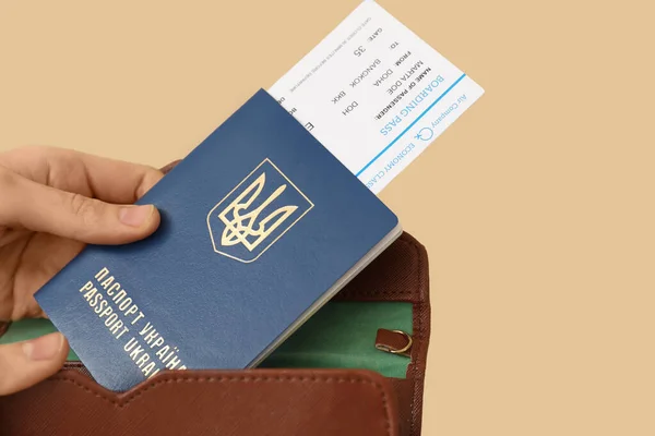 Woman Putting Ukrainian Passport Ticket Wallet Beige Background Closeup — Stock Photo, Image