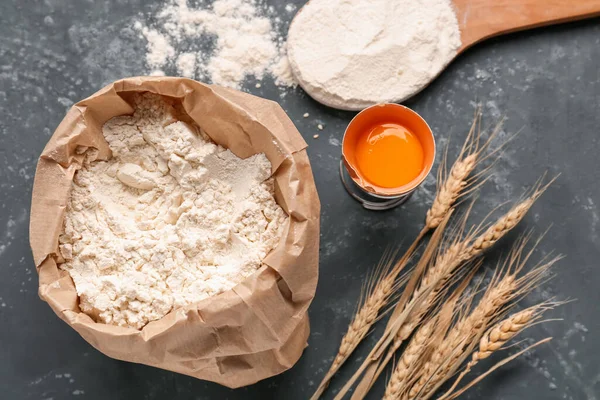 Paper Bag Flour Cracked Egg Spoon Wheat Ears Grey Grunge — Stock Photo, Image
