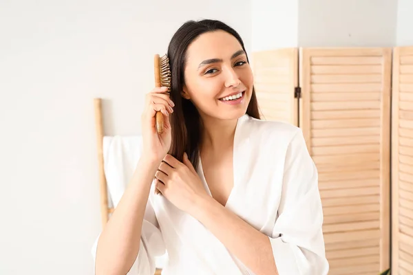 Pretty Young Woman Brushing Hair Bathroom — Stock Photo, Image