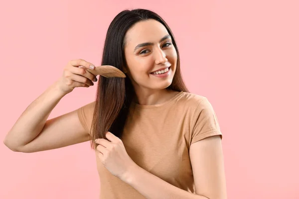 Pretty Young Woman Combing Hair Pink Background — Stock Photo, Image