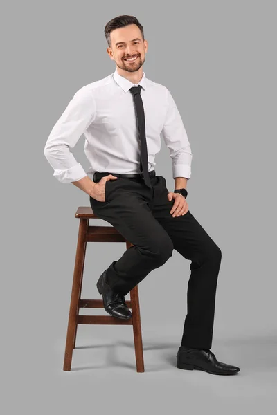 Handsome Businessman Sitting Grey Background — Stock Photo, Image