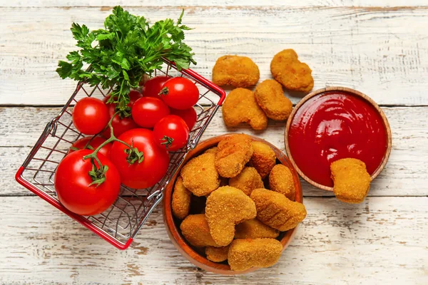 Bowls Tasty Nuggets Ketchup Vegetables Light Wooden Background — Stock Photo, Image