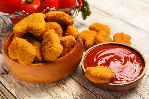 Bowls Tasty Nuggets Ketchup Light Wooden Background — Stock Photo, Image