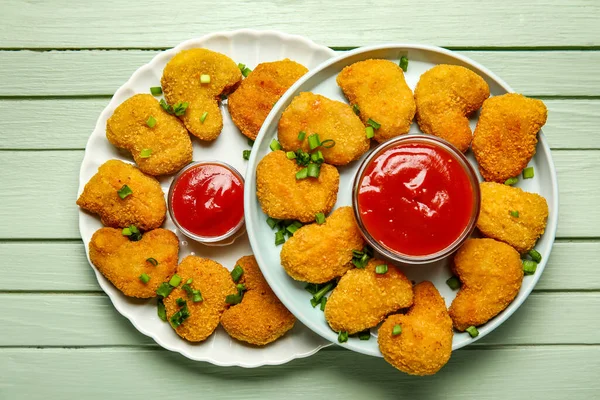 Plates Tasty Nuggets Ketchup Green Wooden Background — Stock Photo, Image