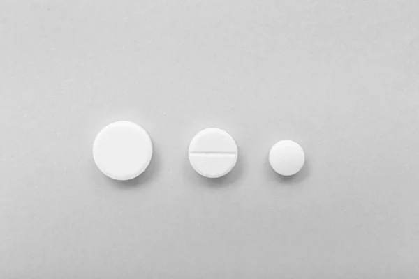 Pillole Bianche Sfondo Grigio — Foto Stock