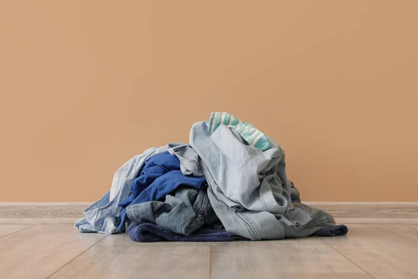 Stack Dirty Clothes Beige Wall — Stock Photo, Image