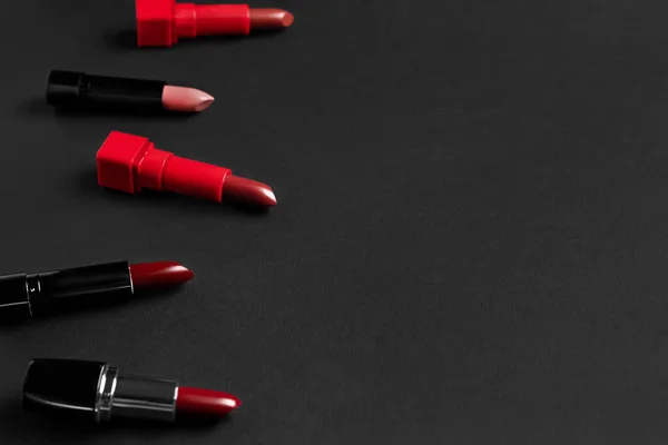 stock image Composition with beautiful lipsticks on dark background