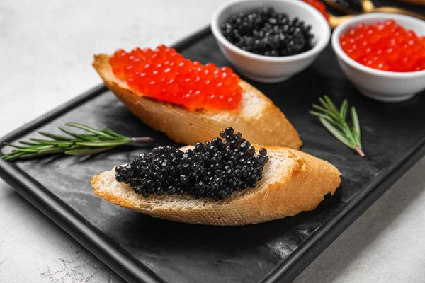 Tasty Bruschettas Red Black Caviar Light Background — Stock Photo, Image
