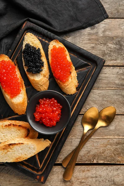 Tasty Bruschettas Red Black Caviar Wooden Background — Stock Photo, Image