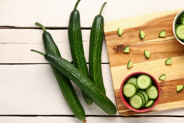 Fresh Cucumbers Cut Pieces Light Wooden Background Closeup — Stock Photo, Image