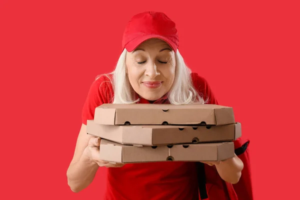 Mature Courier Pizza Red Background — Stock Photo, Image