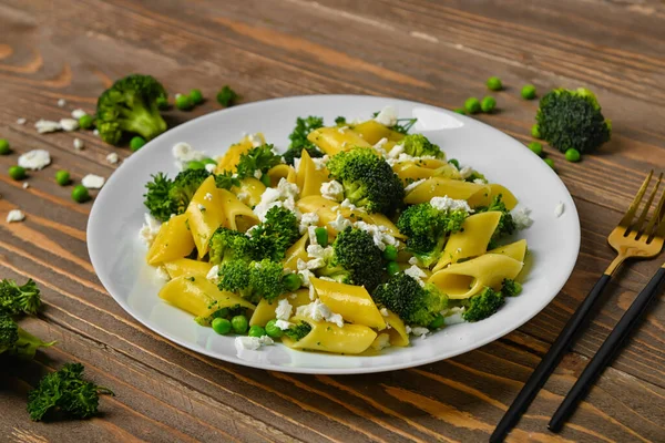 Plate Tasty Penne Pasta Broccoli Wooden Background — Stock Photo, Image