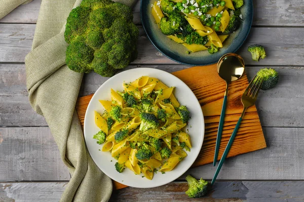 Plates Tasty Pasta Broccoli Grey Wooden Background — Stock Photo, Image