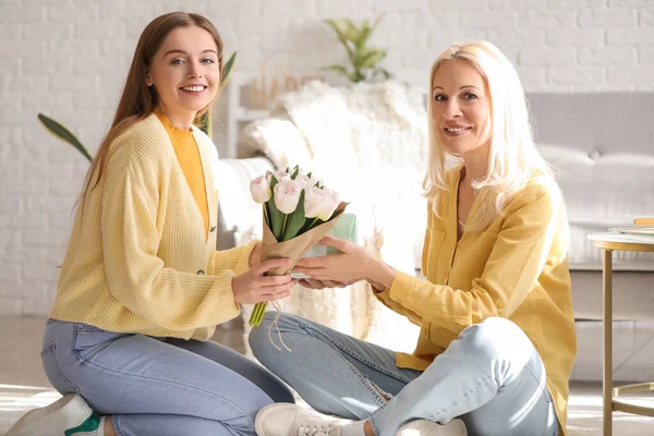 Young Woman Greeting Her Mother Tulips Gift Home — Stock Photo, Image