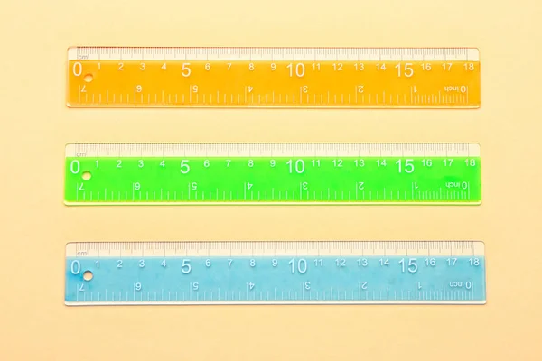 Colorful Plastic Rulers Beige Background — Stock Photo, Image