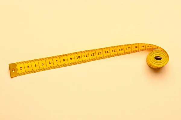 Orange Measuring Tape Beige Background — Stock Photo, Image