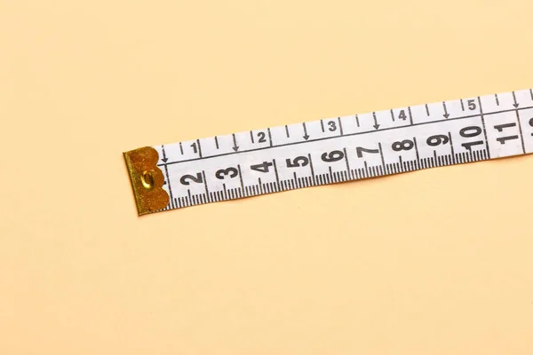 White Measuring Tape Beige Background — Stock Photo, Image