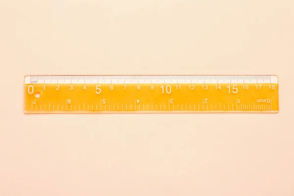 Orange Plastic Ruler Beige Background — Stock Photo, Image
