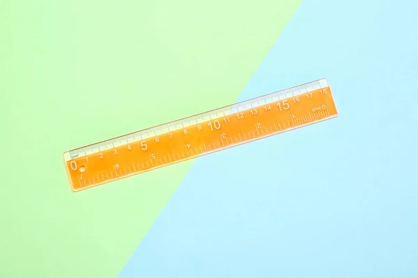Regla Plástico Naranja Sobre Fondo Color —  Fotos de Stock