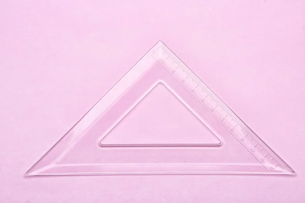 Regla Plástico Triángulo Transparente Sobre Fondo Rosa —  Fotos de Stock