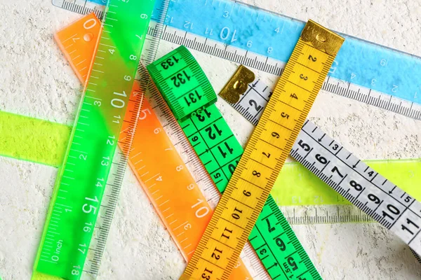 Colorful Plastic Rulers Measuring Tapes Light Grunge Background — Stock Photo, Image