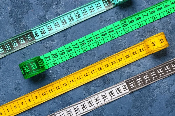 Colorful Measuring Tapes Blue Grunge Background — Stock Photo, Image