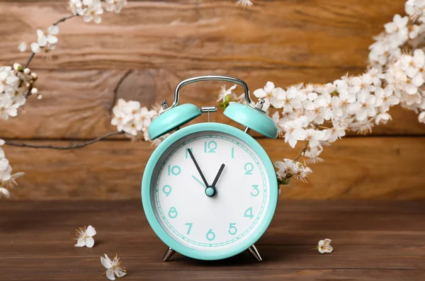 Blooming Spring Branches Turquoise Alarm Clock Wooden Background — Stock Photo, Image